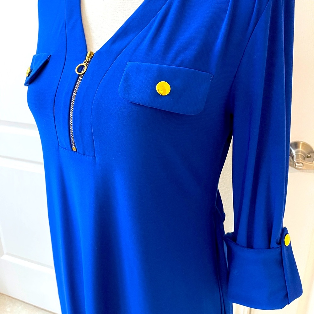 Beautiful wrinkle free and stretchy cobalt blue dress with gold accents.